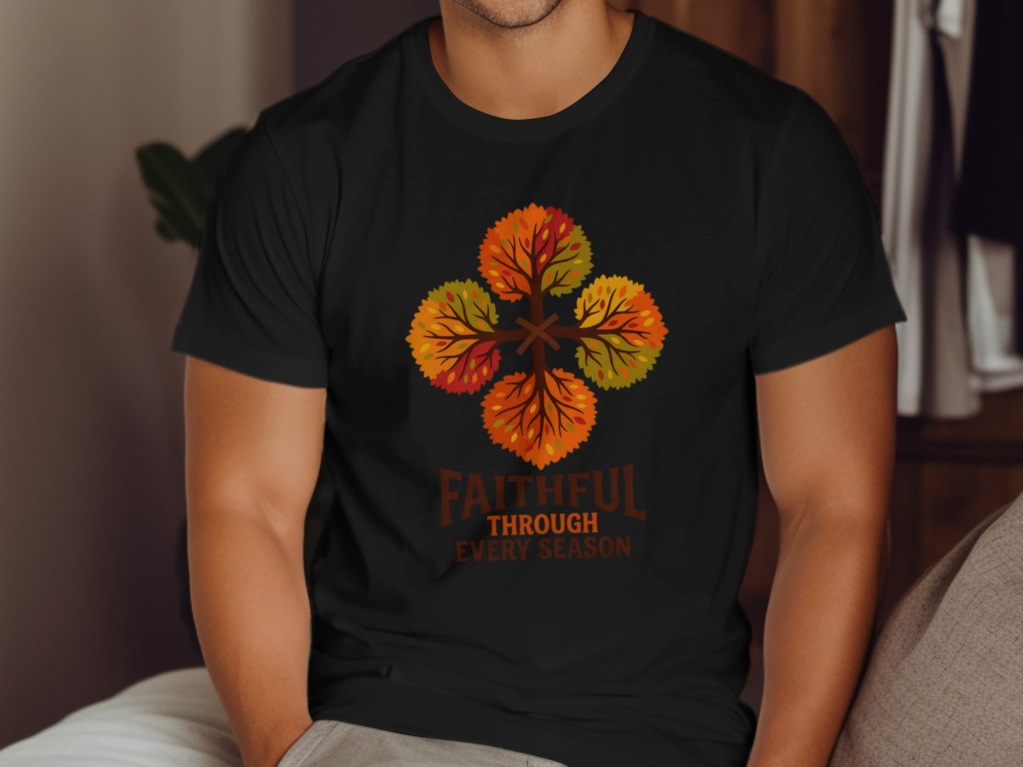 Black t-shirt with four stylized autumn trees forming a cross, with "Faithful Through Every Season" text.
