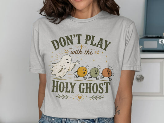T-shirt with ghosts and text: Don't Play with the Holy Ghost.
