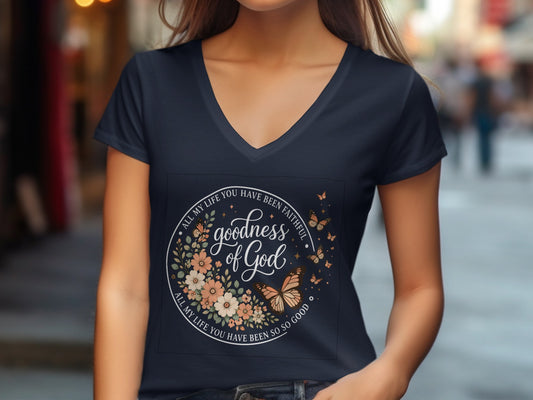 Navy v-neck t-shirt with circular floral and butterfly design and text.