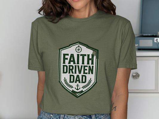 Olive green t-shirt with a shield logo that reads "Faith Driven Dad".