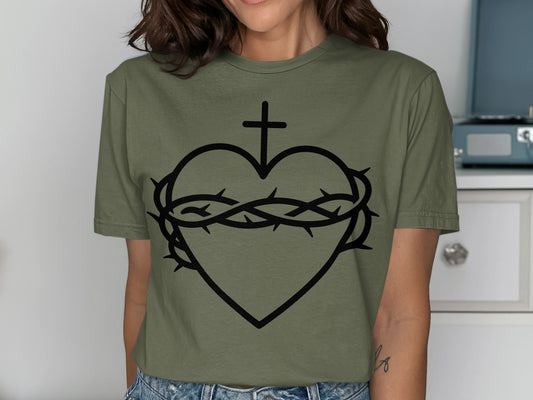 Green t-shirt with black Sacred Heart and crown of thorns graphic.
