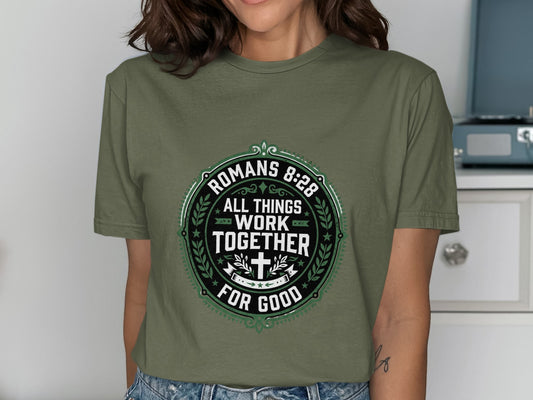 Green t-shirt with "Romans 8:28 All Things Work Together For Good" text.
