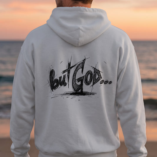 White hoodie with "But God..." hand-drawn text on the back.