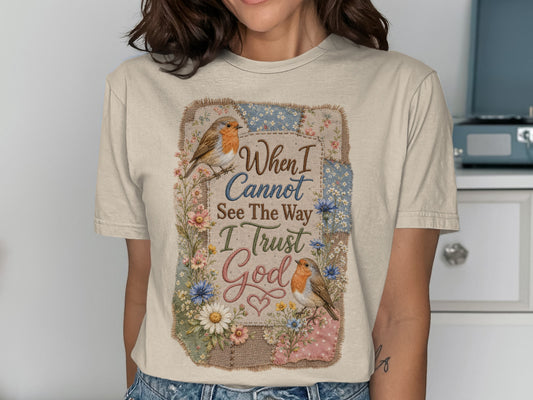 T-shirt with birds, flowers, and "When I Cannot See The Way I Trust God" text.