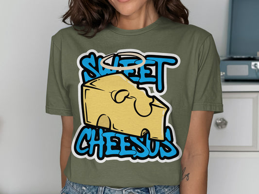 Green t-shirt with "Sweet Cheesus" text and cartoon cheese slice with halo.
