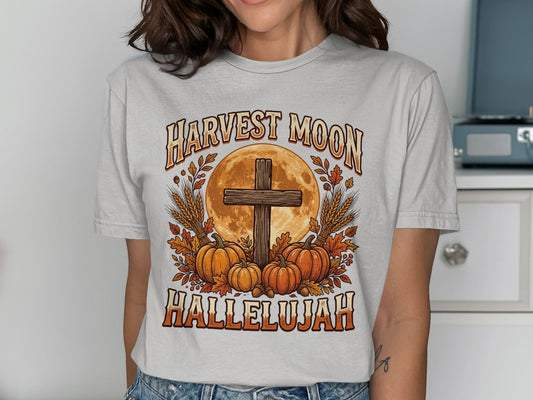 Harvest Moon Hallelujah graphic with cross, pumpkins, and wheat.