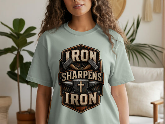 Light blue t-shirt with "IRON SHARPENS IRON" text and anvil graphic.