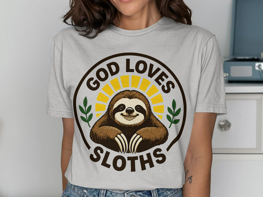 Brown t-shirt with a smiling sloth graphic and "God Loves Sloths" text.