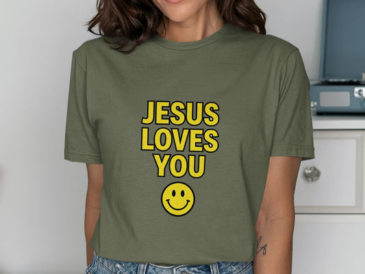 Green t-shirt with "JESUS LOVES YOU" and a smiley face.