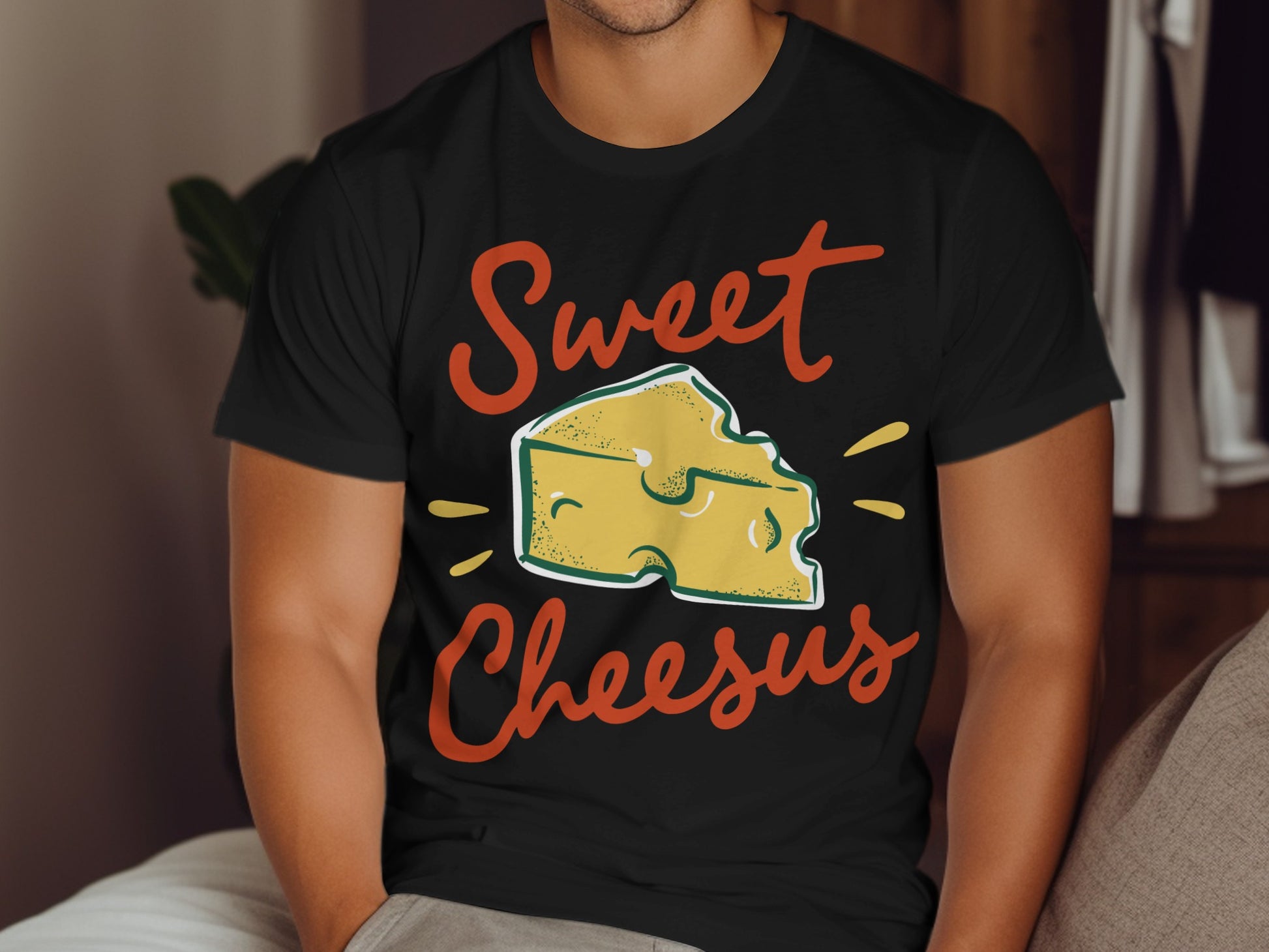 Black t-shirt with "Sweet Cheesus" text and cartoon cheese wedge graphic.