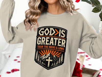 Crewneck sweatshirt with "God is greater than the highs and lows" graphic.