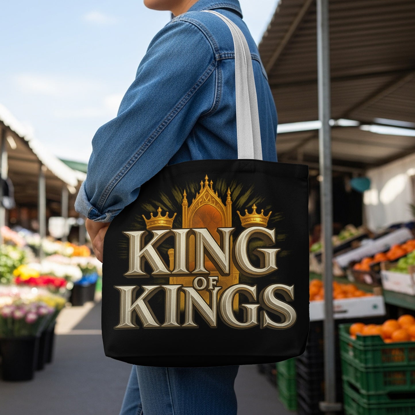 Tote bag with "King of Kings" text, golden throne, and crowns on black background.