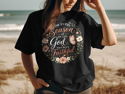 Black t-shirt with floral wreath and "God Has Been Faithful" text.