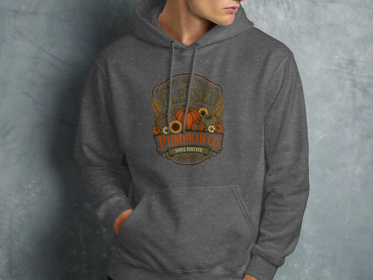 Dark gray hoodie with "Blessed Pumpkin Co. Since Forever" text and autumn graphics.