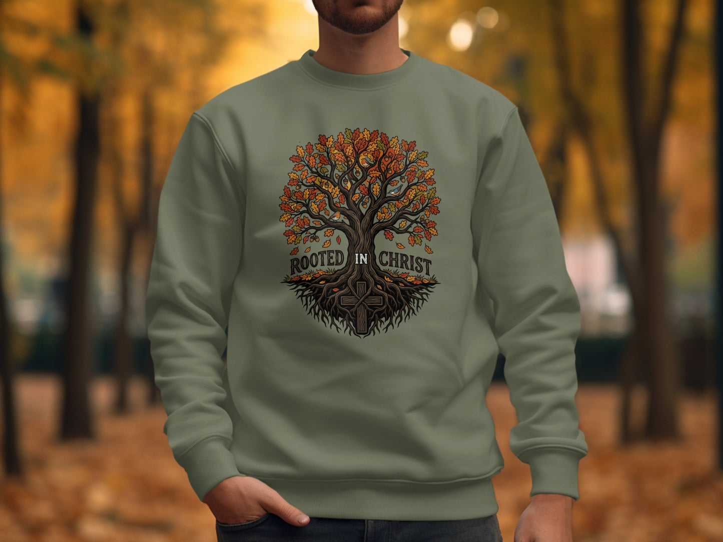 Green crewneck sweatshirt with "ROOTED IN CHRIST" tree and cross graphic.