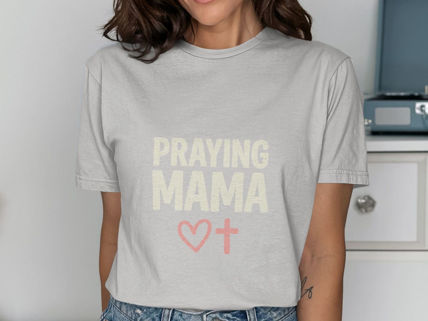 Gray t-shirt with "PRAYING MAMA" text, a heart, and a cross.