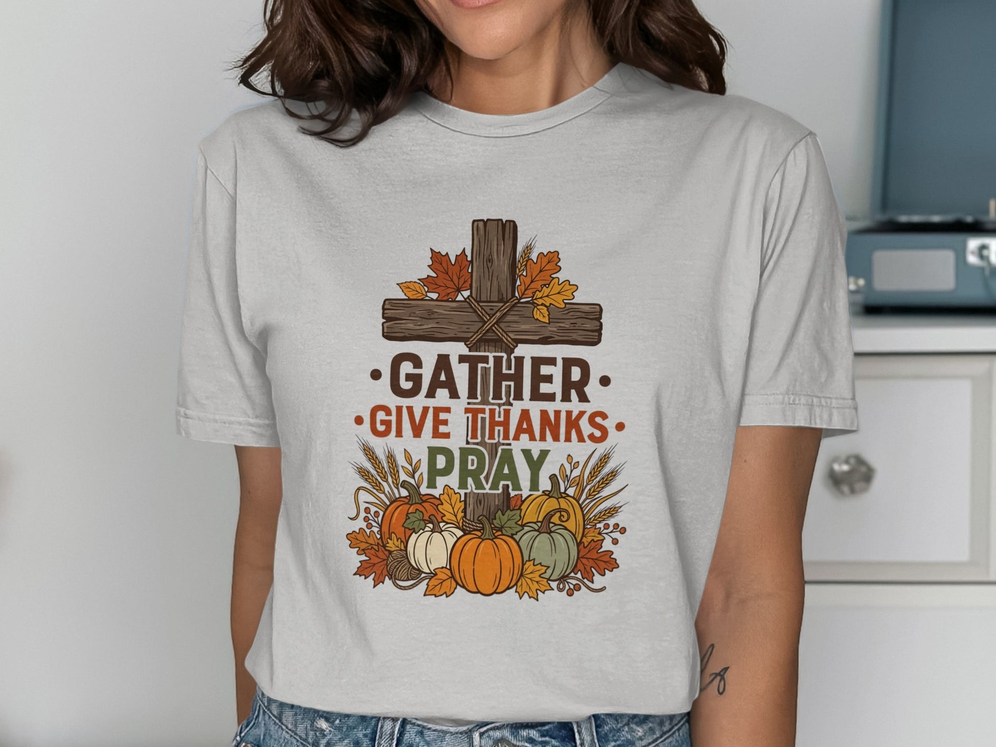 Cross with autumn leaves, pumpkins, and text "Gather Give Thanks Pray".