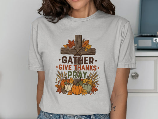 Cross with autumn leaves, pumpkins, and text "Gather Give Thanks Pray".
