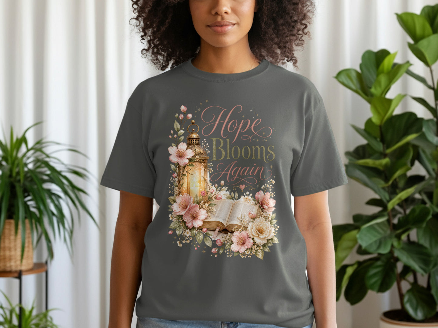 Dark grey t-shirt with "Hope Blooms Again" text and floral lantern design.
