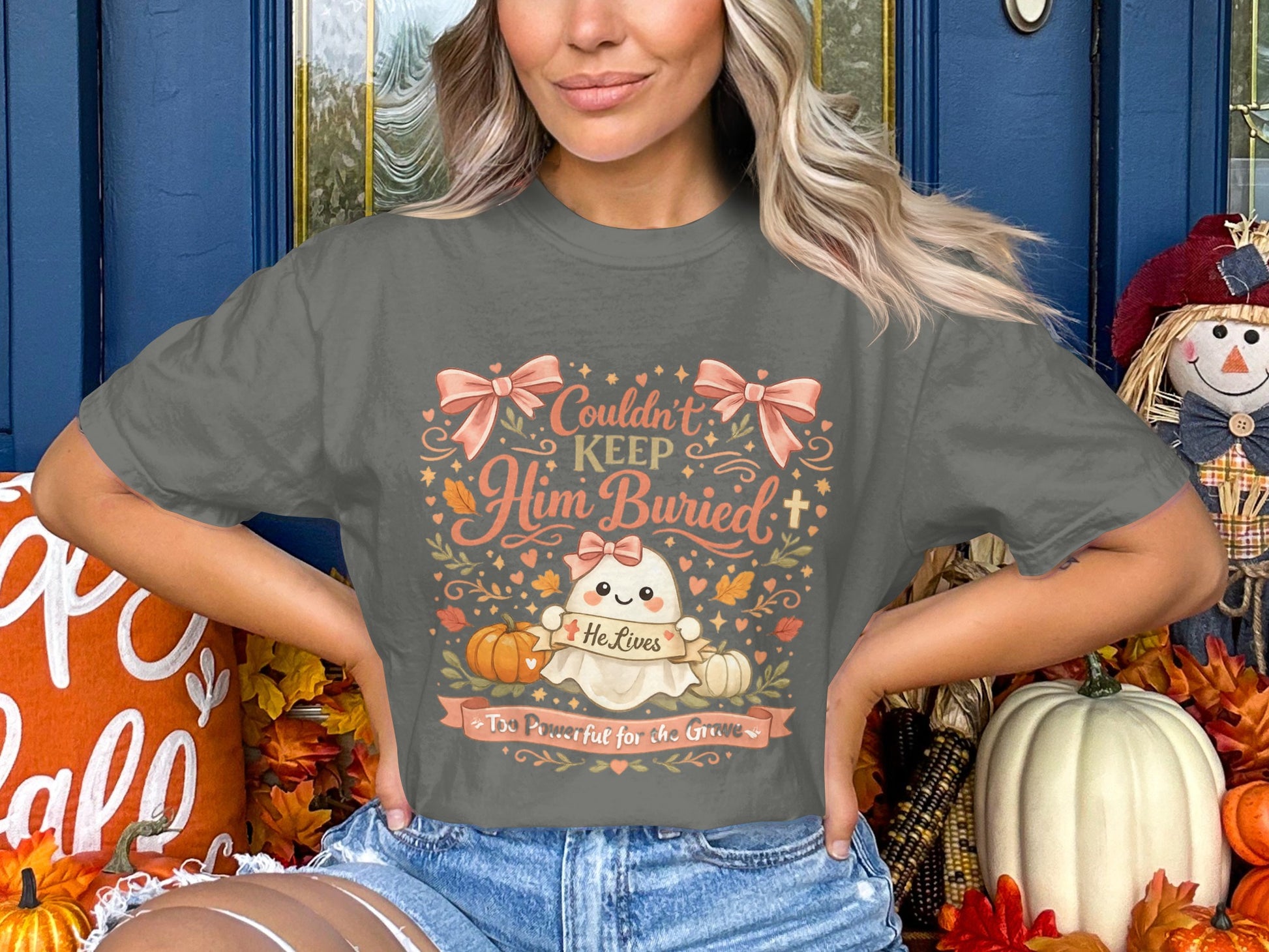 Ghost graphic on a t-shirt with text: Couldn't Keep Him Buried, He Lives, Too Powerful for the Grave.