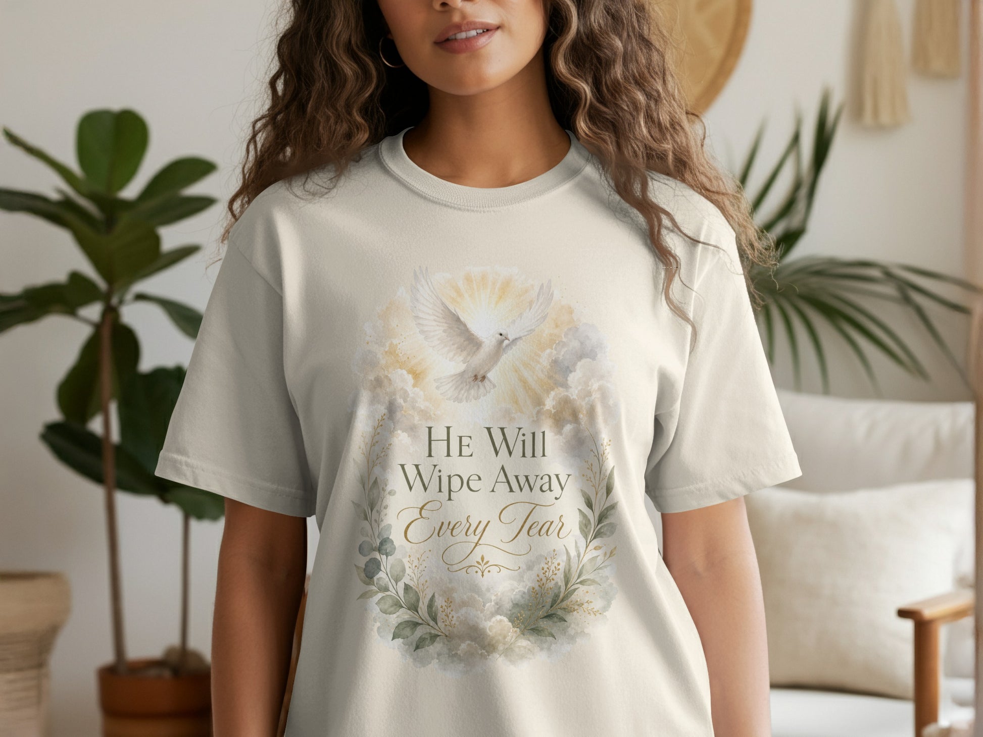 Cream t-shirt with dove, clouds, and text "HE Will Wipe Away Every Tear".