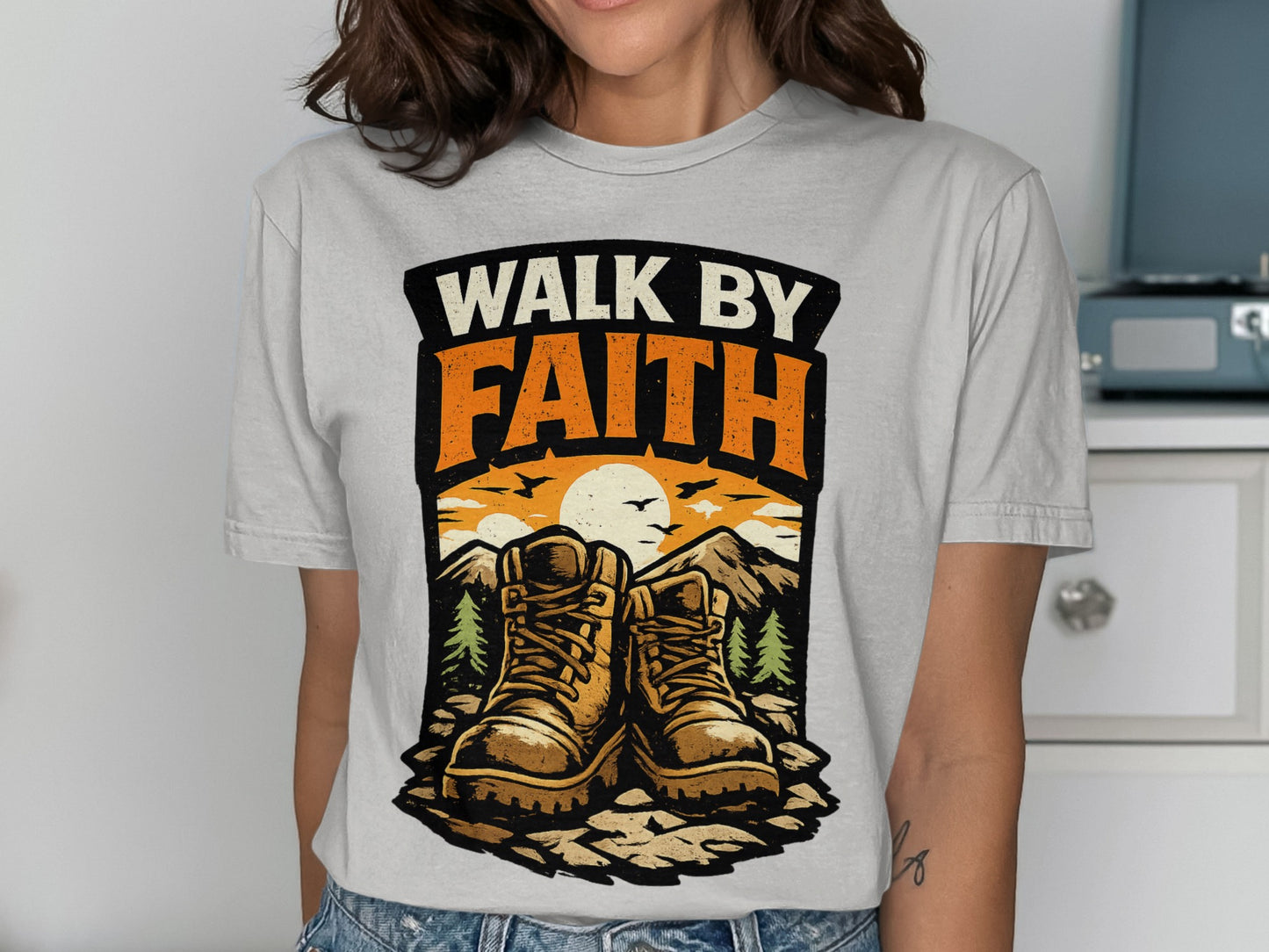 Hiking boots and mountains with "Walk by Faith" text.