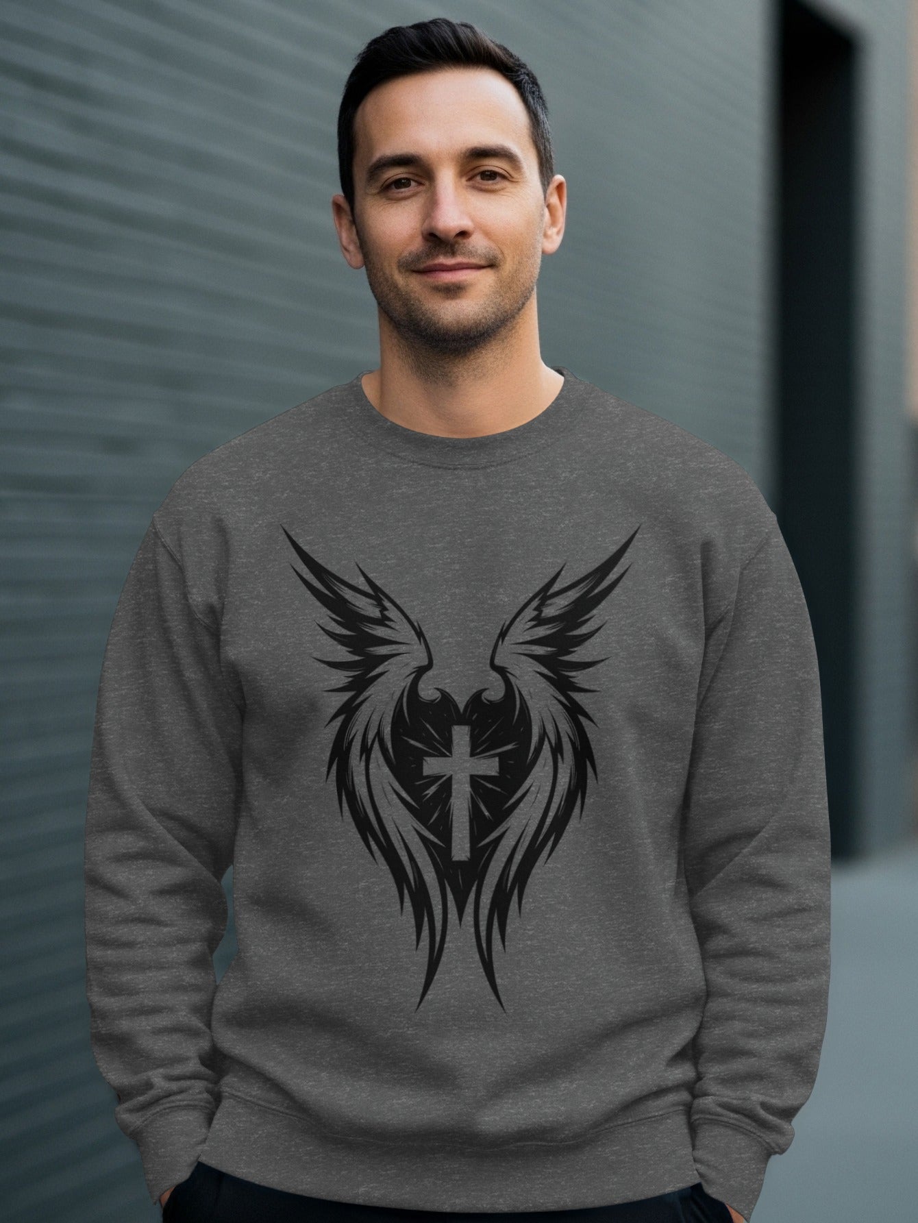 Gray sweatshirt with black winged cross design on front.