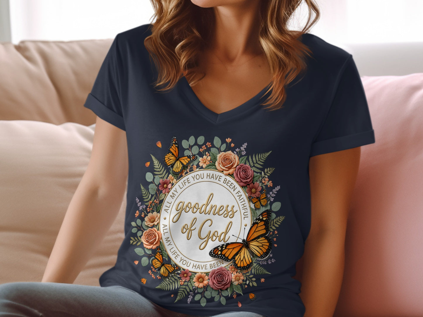 Navy t-shirt with floral wreath and butterflies, reads "goodness of God".