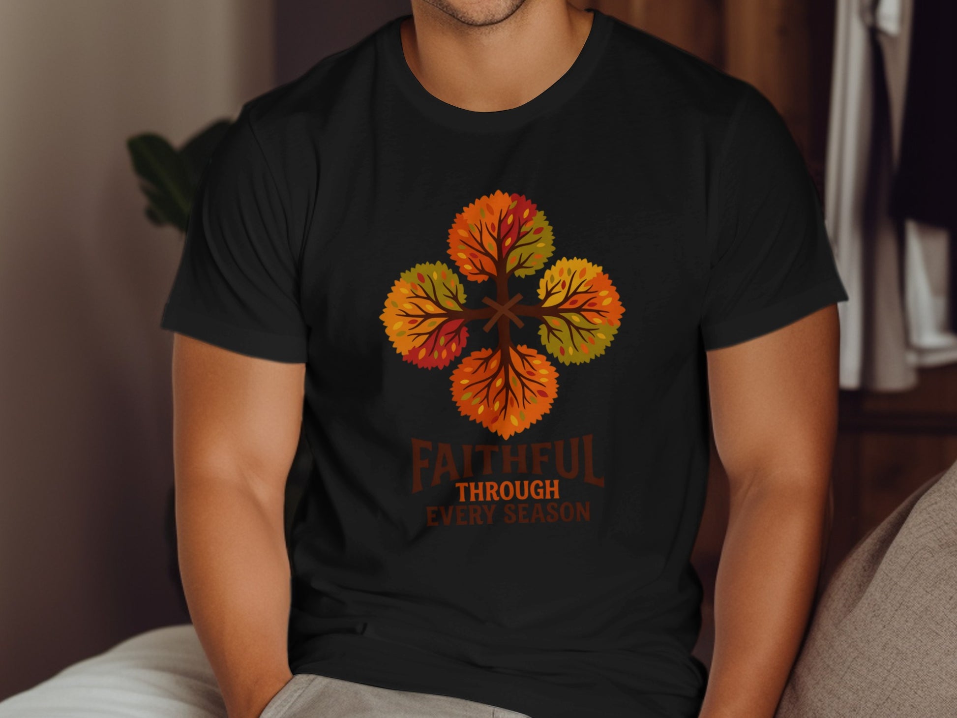 Black t-shirt with four stylized autumn trees forming a cross, with "Faithful Through Every Season" text.