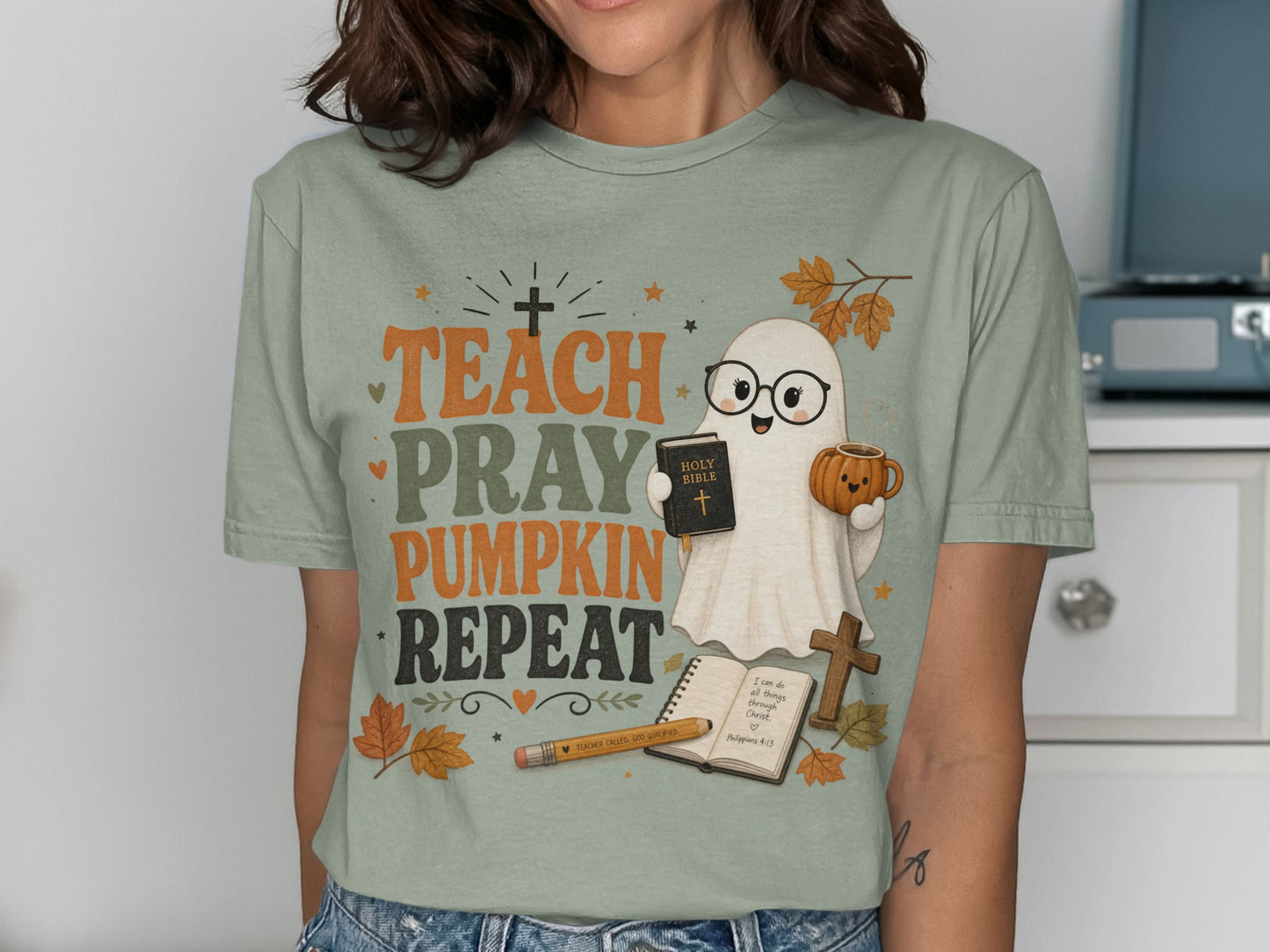 Ghost holding Holy Bible and pumpkin mug with text Teach Pray Pumpkin Repeat.