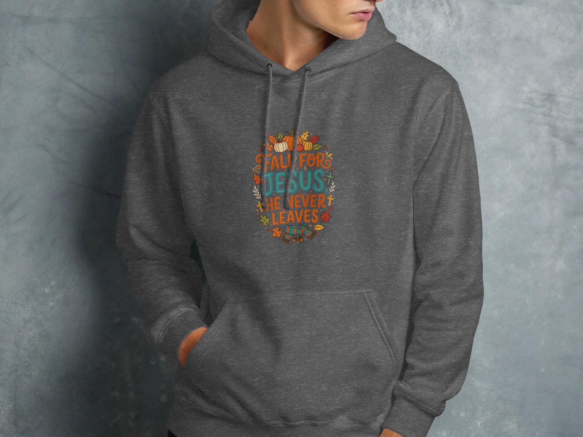 Grey hoodie with "Fall for Jesus, He Never Leaves" text and autumn leaves.