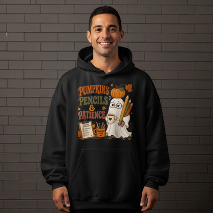 Ghost with pumpkin, pencils, and coffee on black hoodie reading "Pumpkins Pencils & Patience."