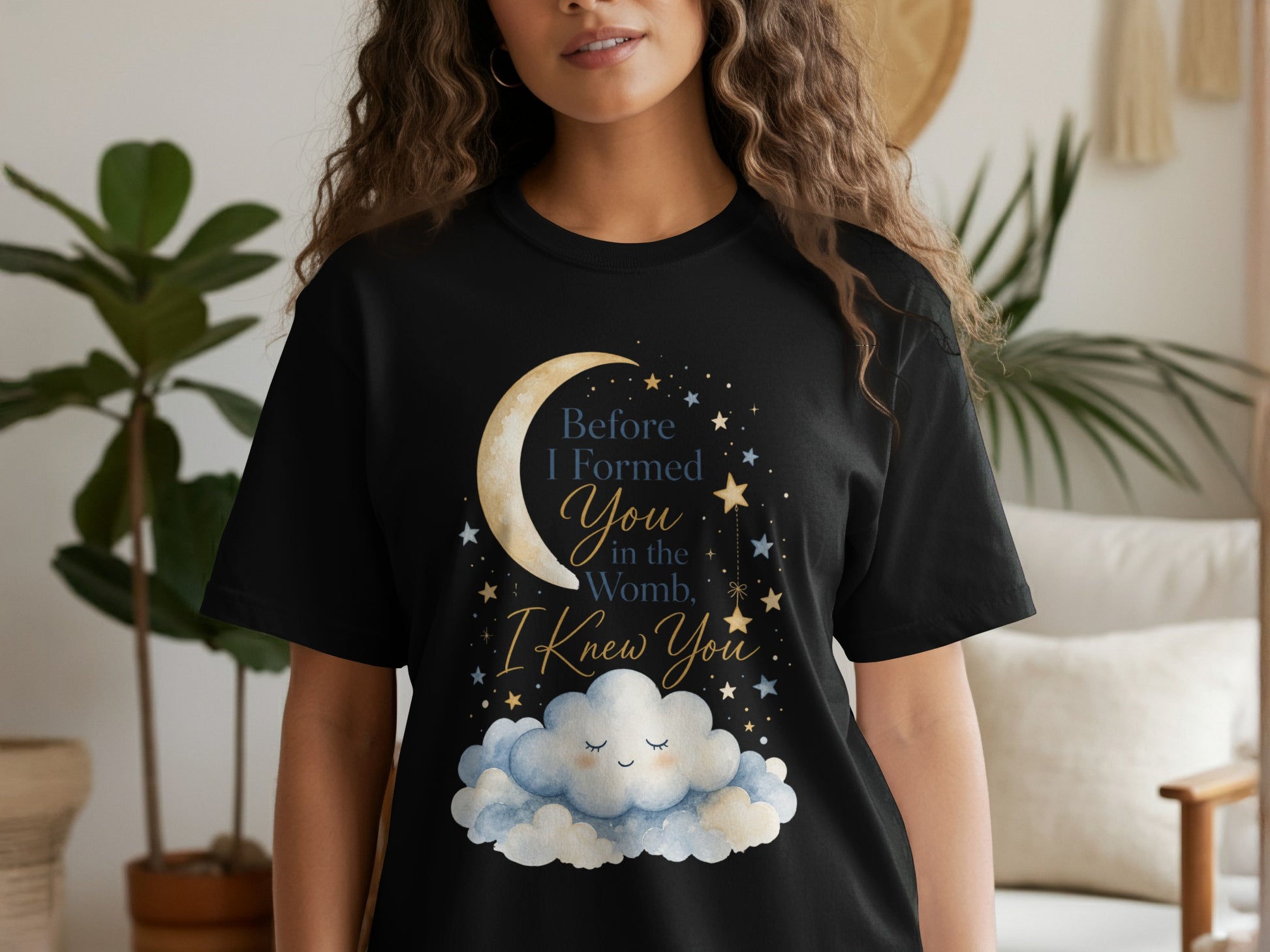 Black t-shirt with moon, stars, and clouds graphic reading "Before I Formed You in the Womb, I Knew You."