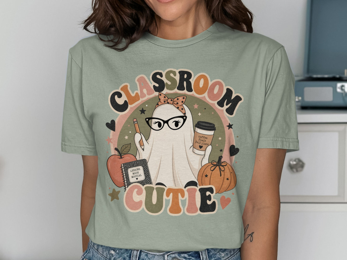 Ghost in glasses with coffee, pencil, apple, and pumpkin under "CLASSROOM CUTIE" text.