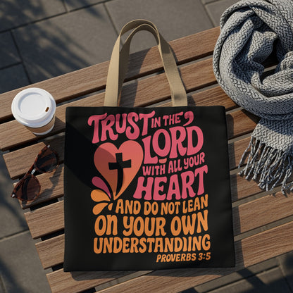 Black tote bag with "Trust in the Lord with all your heart" scripture and cross.