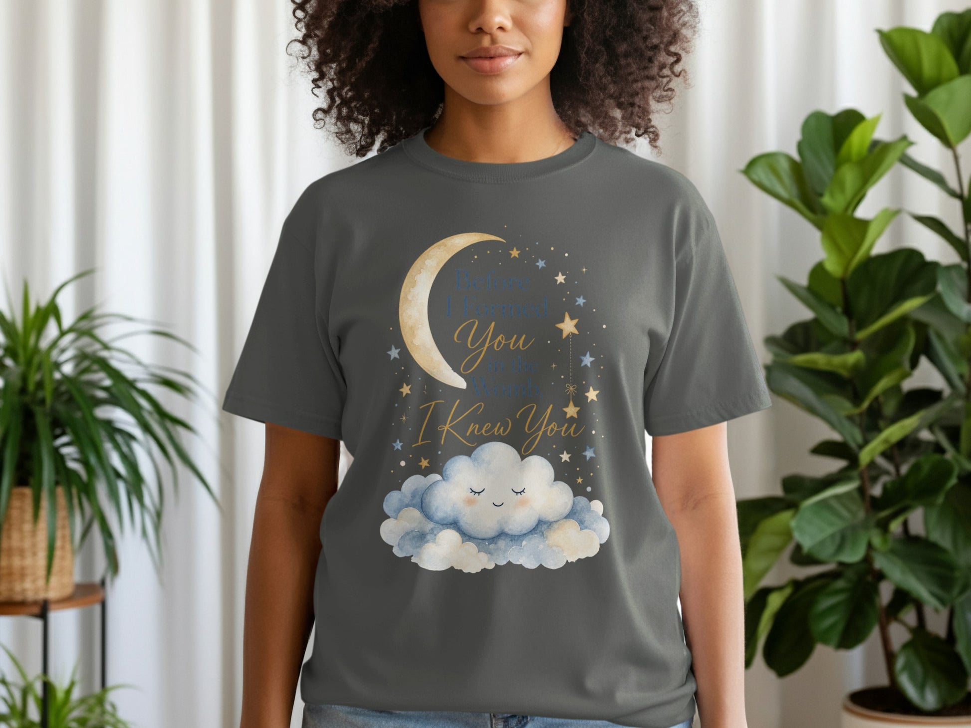 Gray t-shirt with a crescent moon, stars, and clouds graphic saying "Before I formed you in the womb, I knew you."