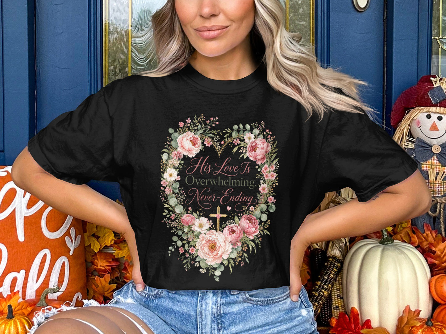 Black t-shirt with floral heart, cross, and text "His Love Is Overwhelming, Never-Ending."