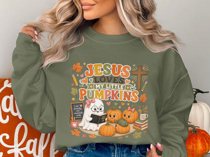 Jesus loves my little pumpkins graphic with a ghost, pumpkins, and religious text.