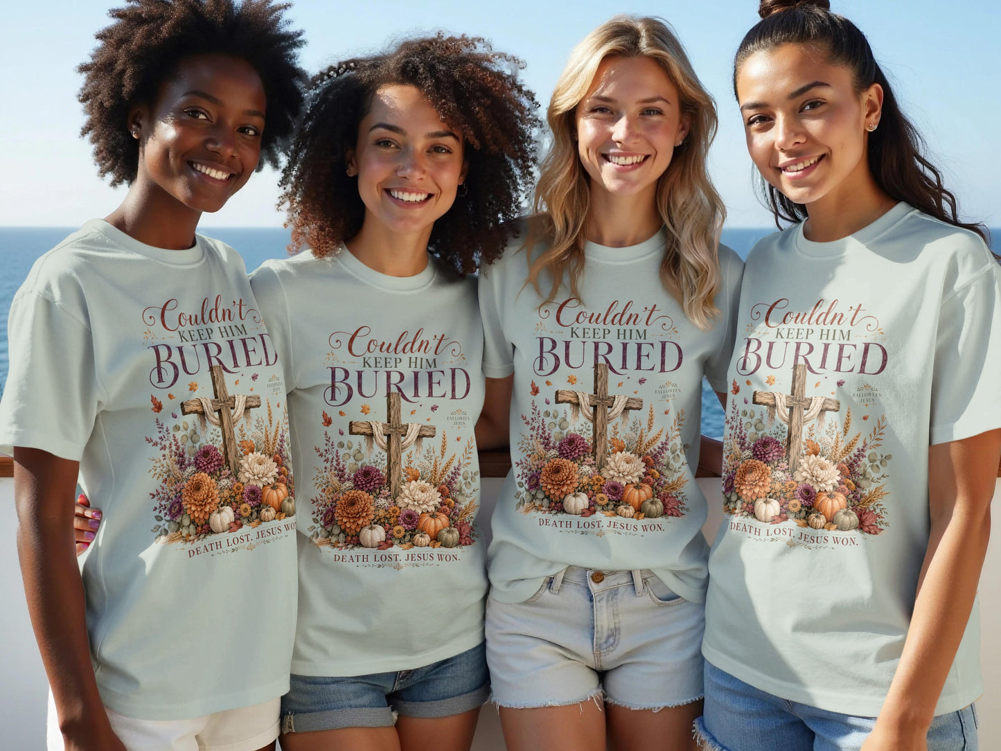 Four women in light blue t-shirts featuring a cross, flowers, pumpkins, and text.