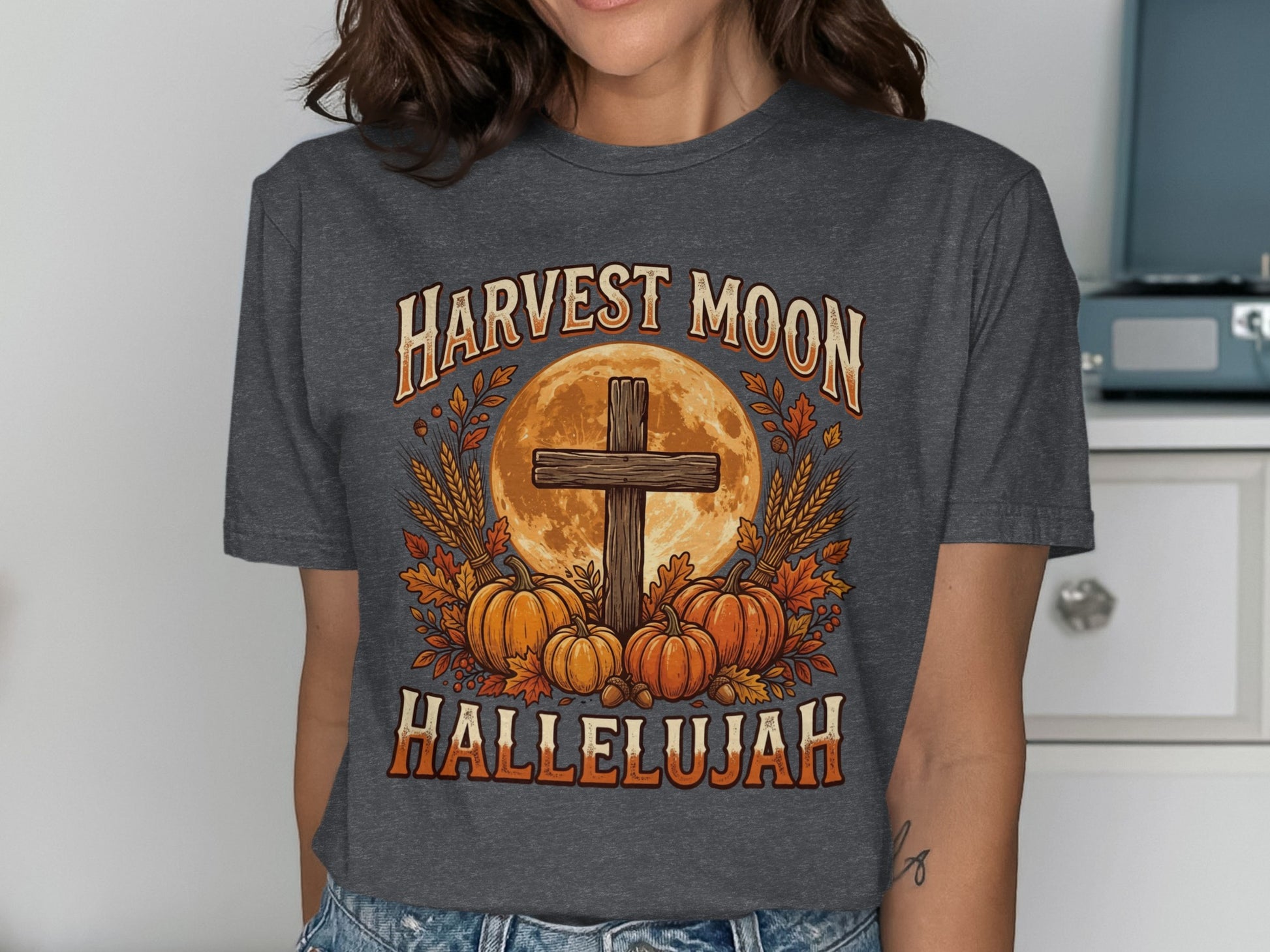 Harvest Moon Hallelujah text with cross, pumpkins, and wheat graphic.