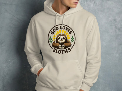 Cream hoodie with "God Loves Sloths" circular graphic featuring a smiling sloth.