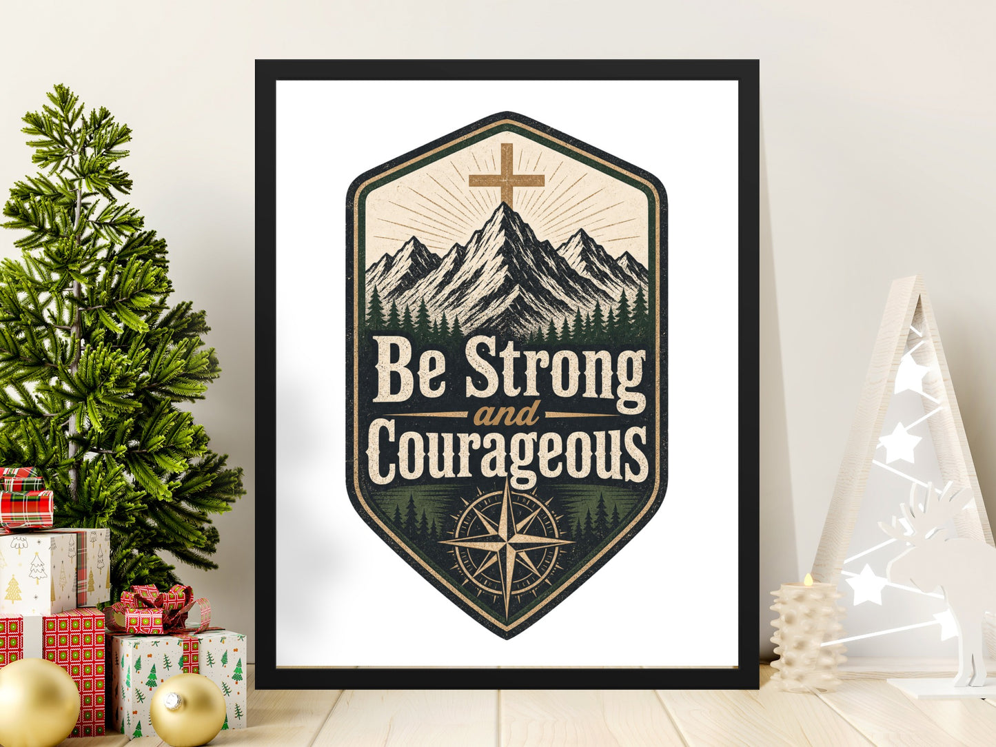 Be Strong and Courageous emblem with mountains, trees, and compass in a black frame.