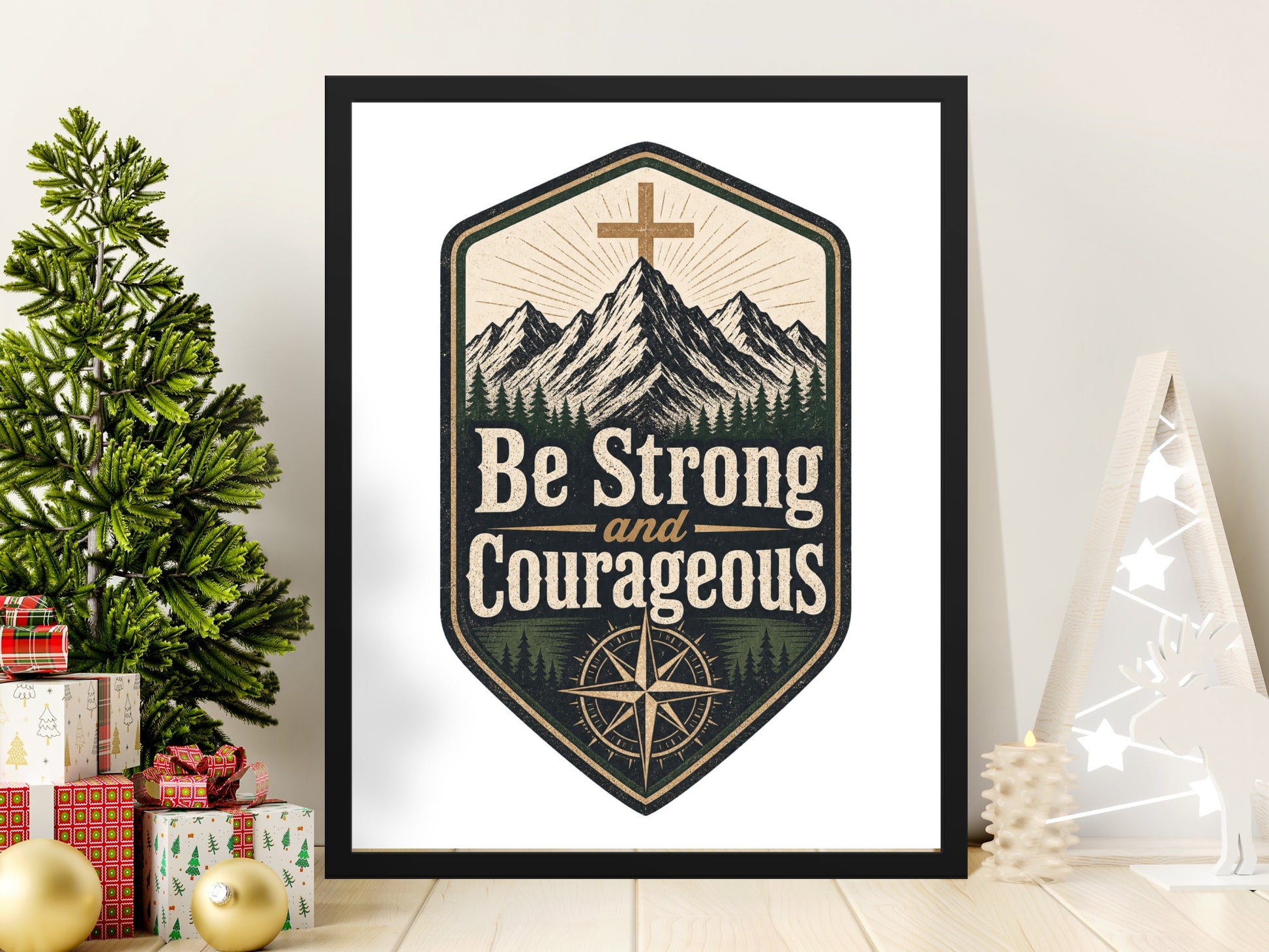 Be Strong and Courageous emblem with mountains, trees, and compass in a black frame.