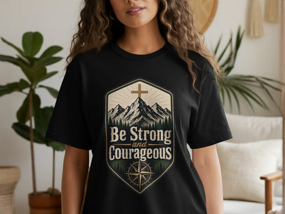 Black t-shirt with "Be Strong and Courageous" text in a mountain scene.