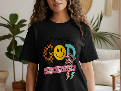 Black t-shirt with "Don't play with me GOD is on my side" and graphic elements.