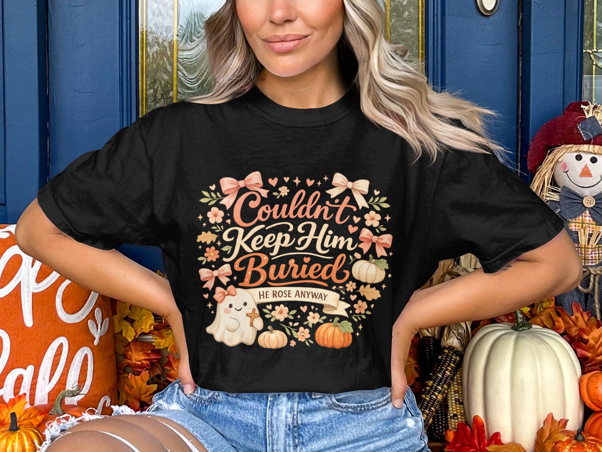 Black t-shirt with "Couldn't Keep Him Buried He Rose Anyway" text and a ghost.