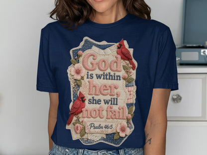 Navy t-shirt with floral accents and text "God is within her she will not fail".