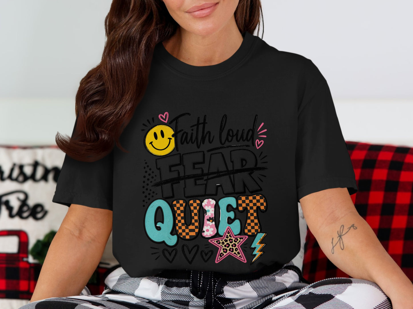Black t-shirt with "Faith loud fear quiet" graphic, smiley face, and star.