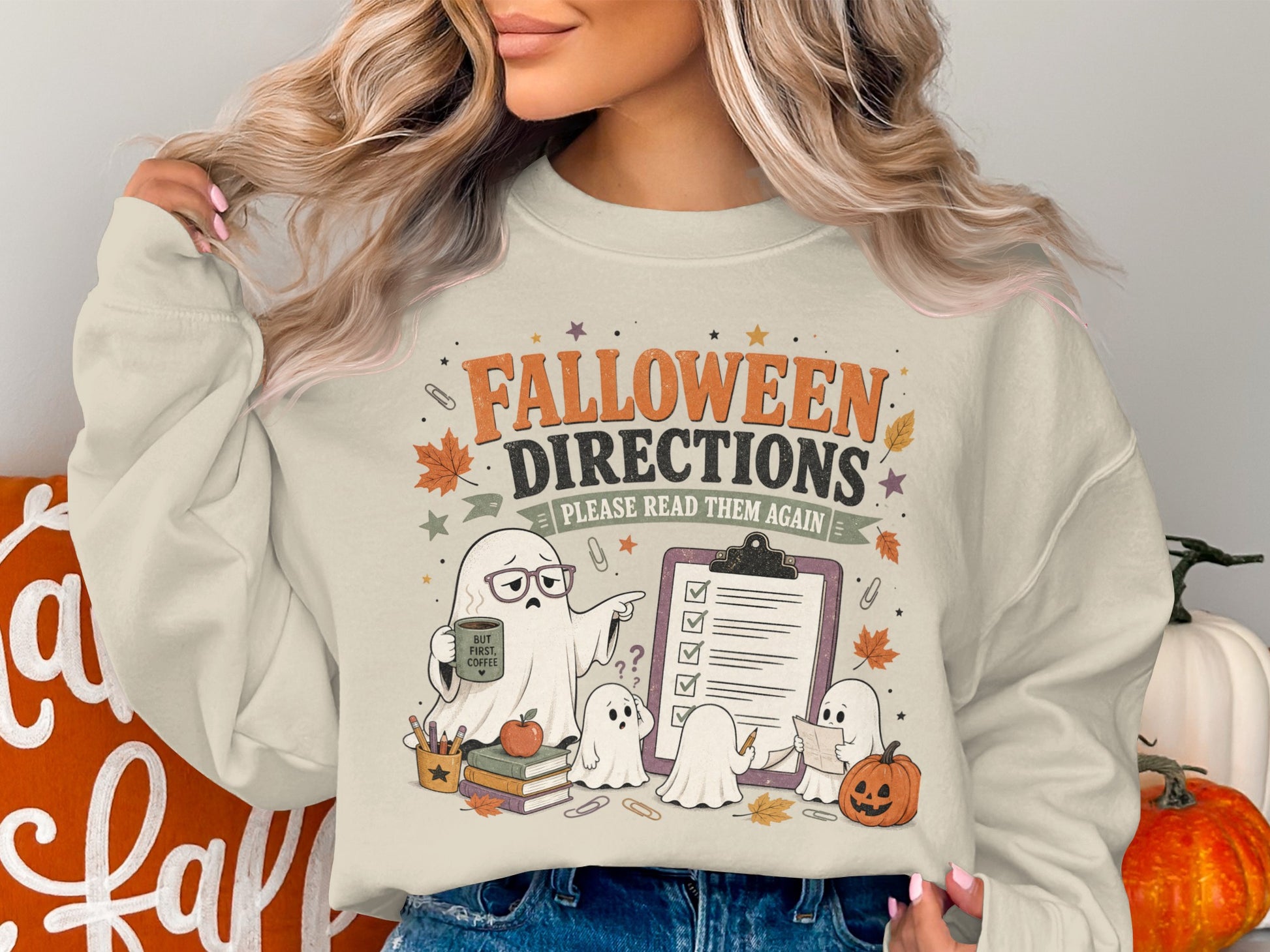 Cream sweatshirt with "Falloween Directions Please Read Them Again" and ghost illustrations.