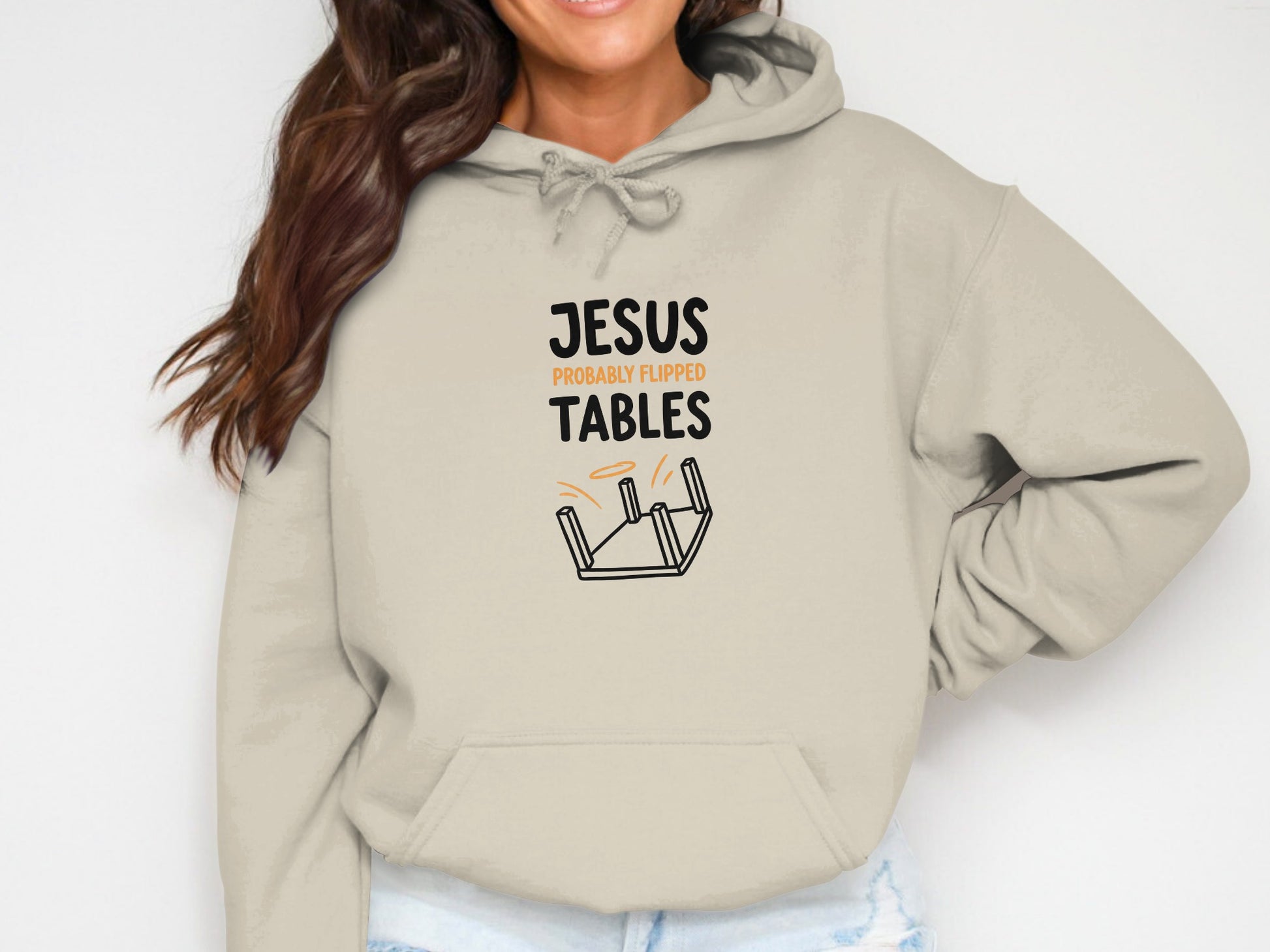 Beige hoodie with "Jesus probably flipped tables" graphic.